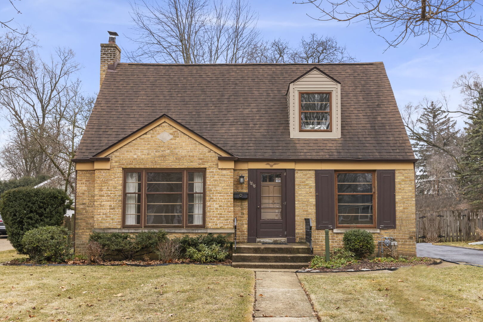 1818 East Indiana Street Wheaton, IL 60187 - Photo 1 of 29 a front view of a house with a yard