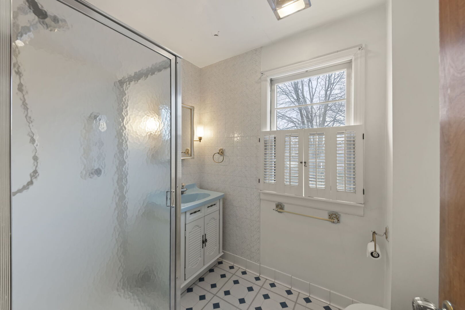 1818 East Indiana Street Wheaton, IL 60187 - Photo 13 of 29 a bathroom with a shower and a sink