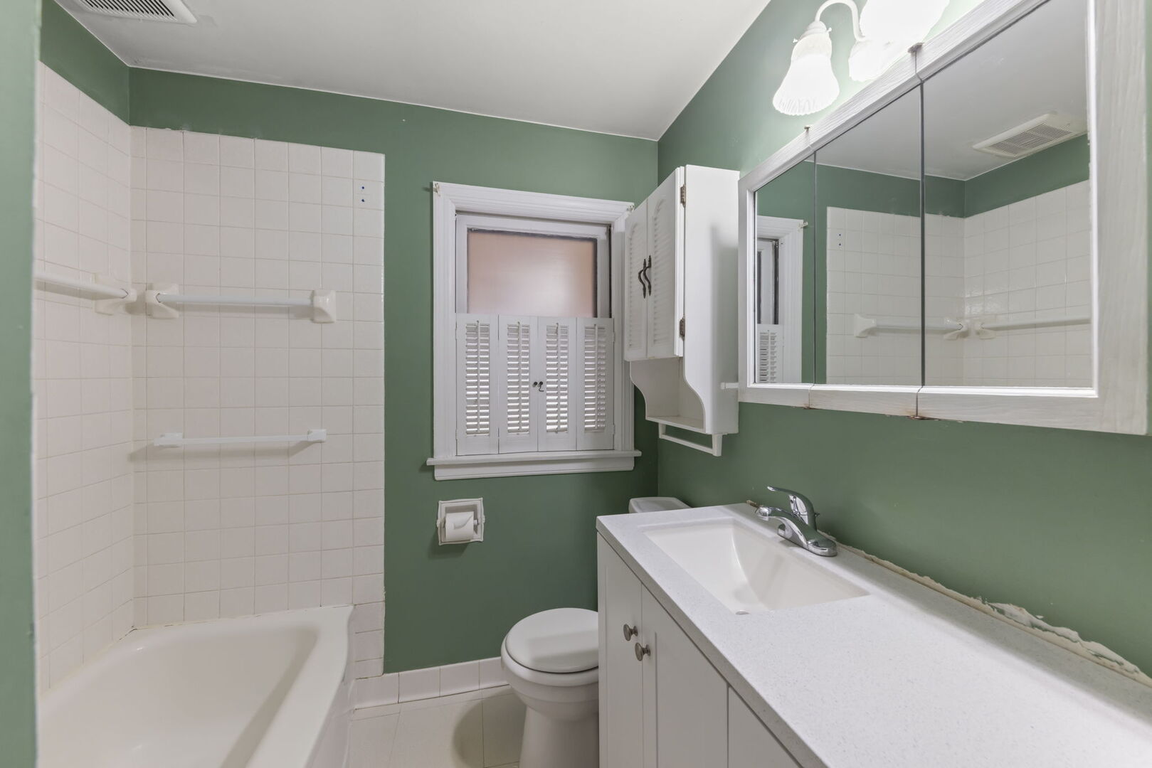 1818 East Indiana Street Wheaton, IL 60187 - Photo 15 of 29 a bathroom with a sink a toilet and shower