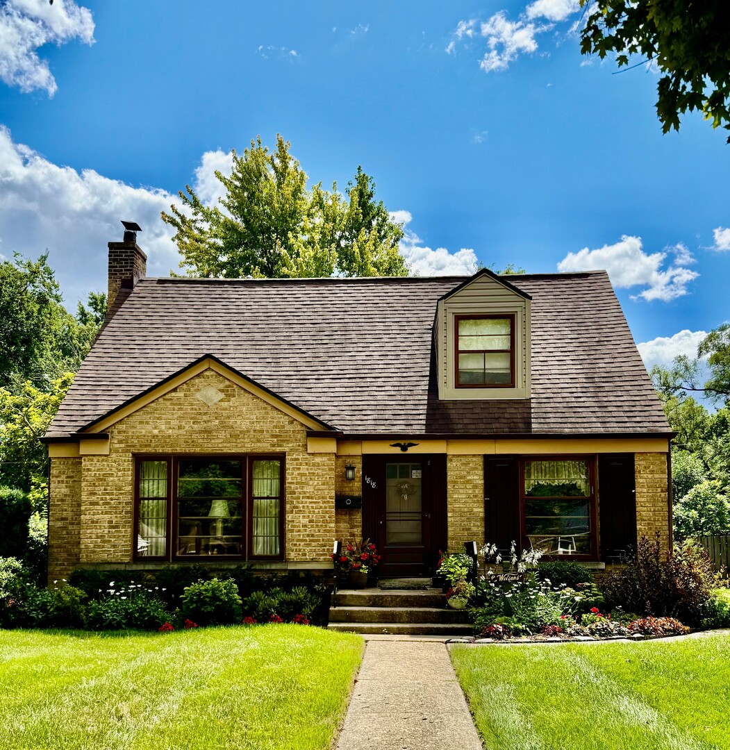 1818 East Indiana Street Wheaton, IL 60187 - Photo 20 of 29 a front view of a house with a yard