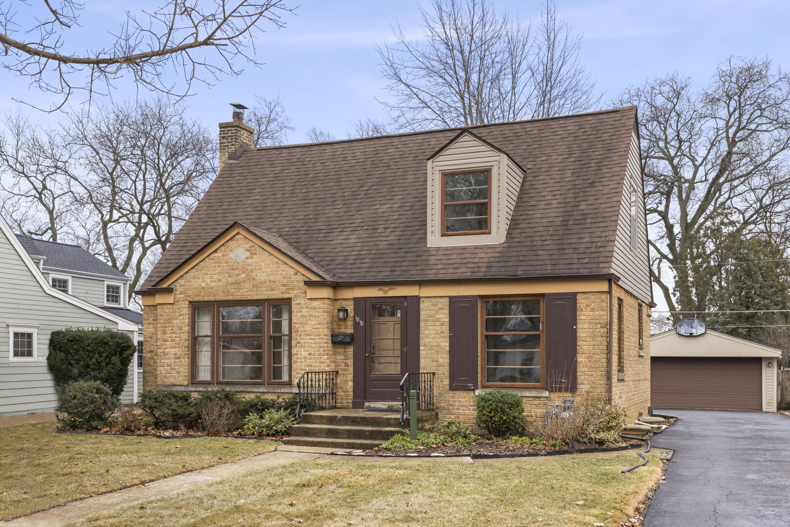 1818 East Indiana Street Wheaton, IL 60187 - Photo 2 of 29 a front view of a house with a yard