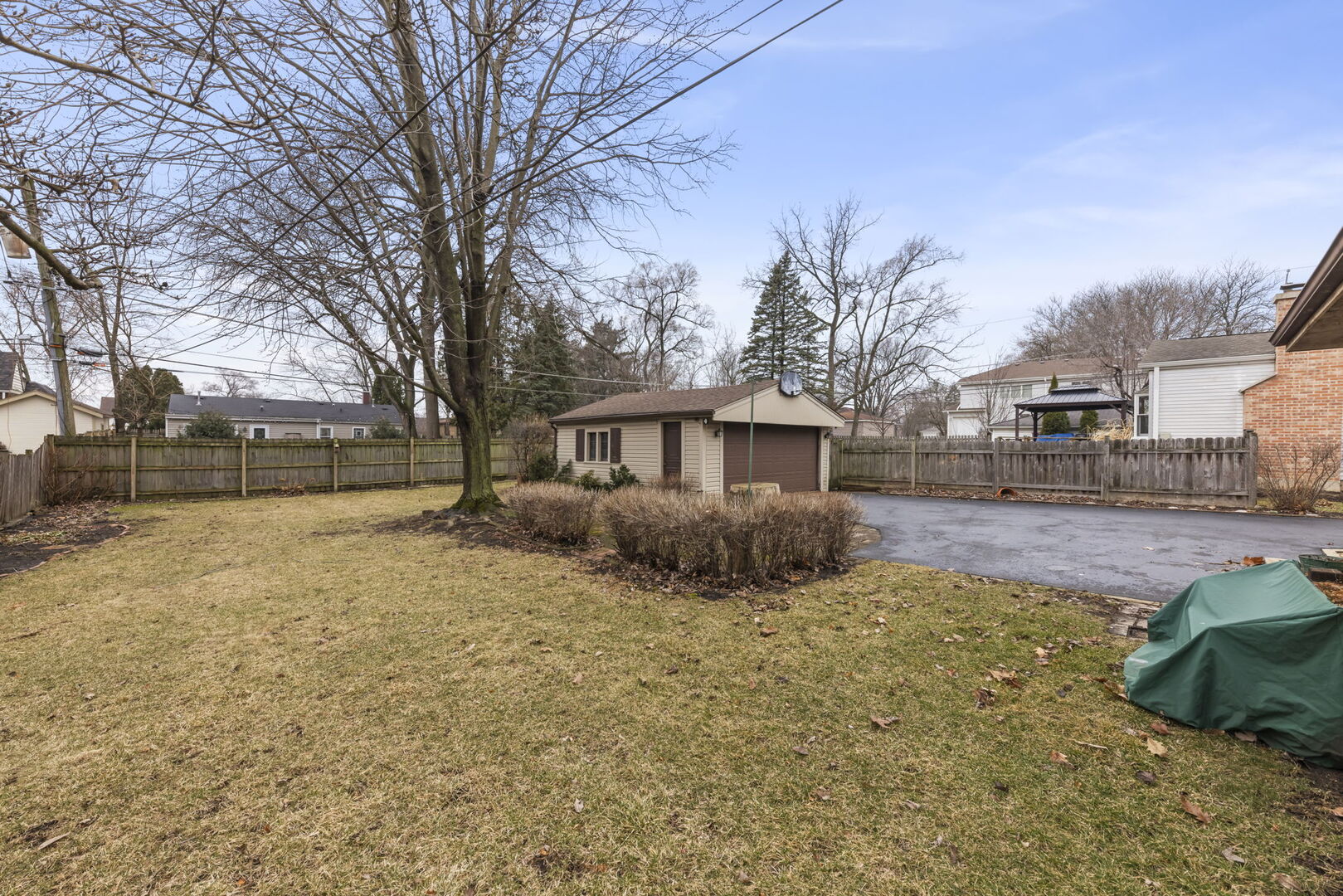 1818 East Indiana Street Wheaton, IL 60187 - Photo 23 of 29 a view of a yard with a house and a large tree