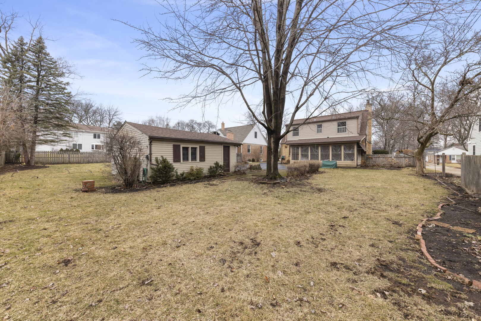 1818 East Indiana Street Wheaton, IL 60187 - Photo 24 of 29 a front view of a house with a yard