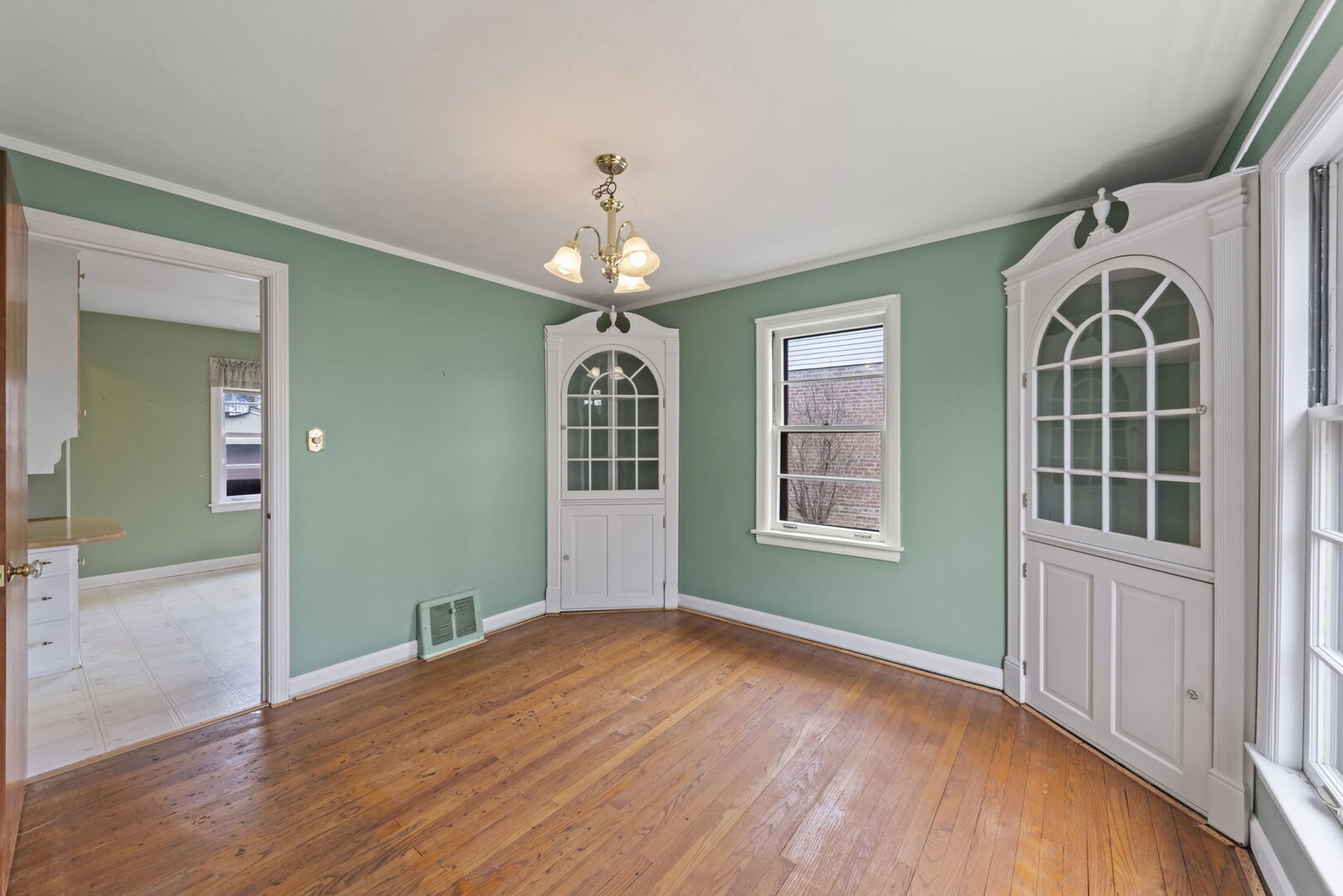 1818 East Indiana Street Wheaton, IL 60187 - Photo 6 of 29 wooden floor in an empty room with a window