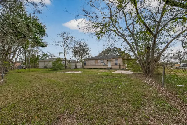 a view of a tree in front of a house