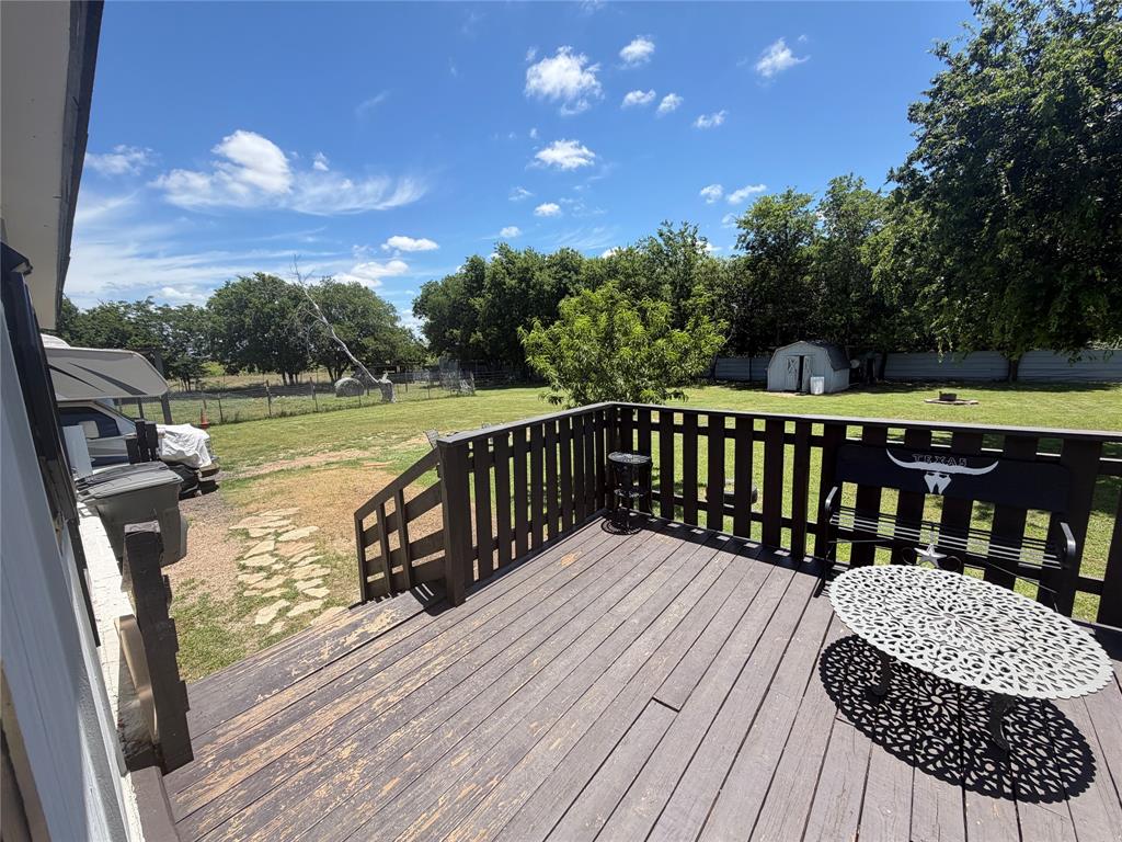 222 Hix Road Cleburne, TX 76031 - Photo 22 of 27 a balcony with wooden floor and outdoor space