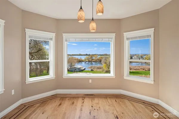 a kitchen with granite countertop white cabinets and sink