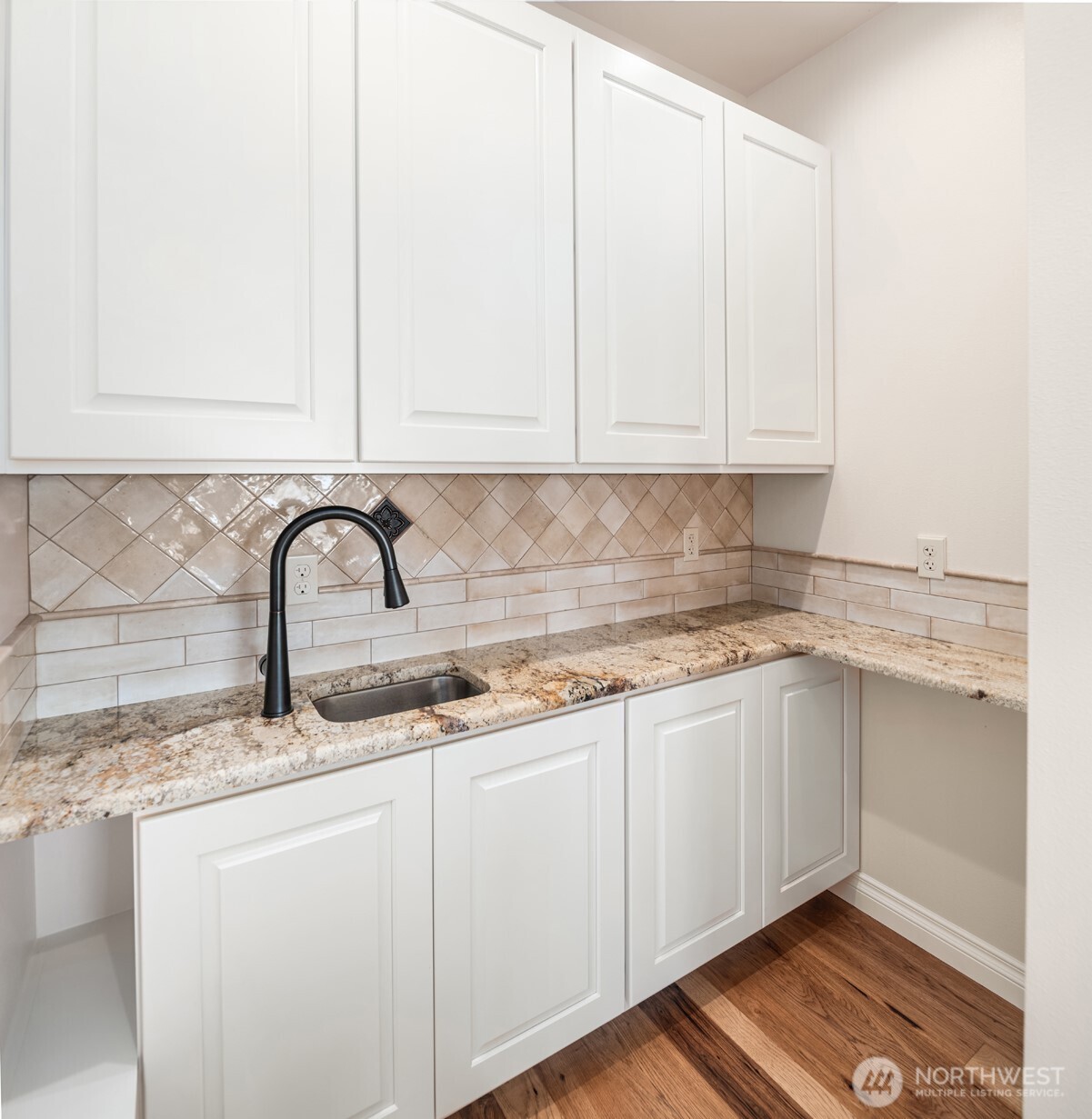 2762 Elgin Road Northeast Moses Lake, WA 98837 - Photo 15 of 37 a kitchen with granite countertop white cabinets and sink