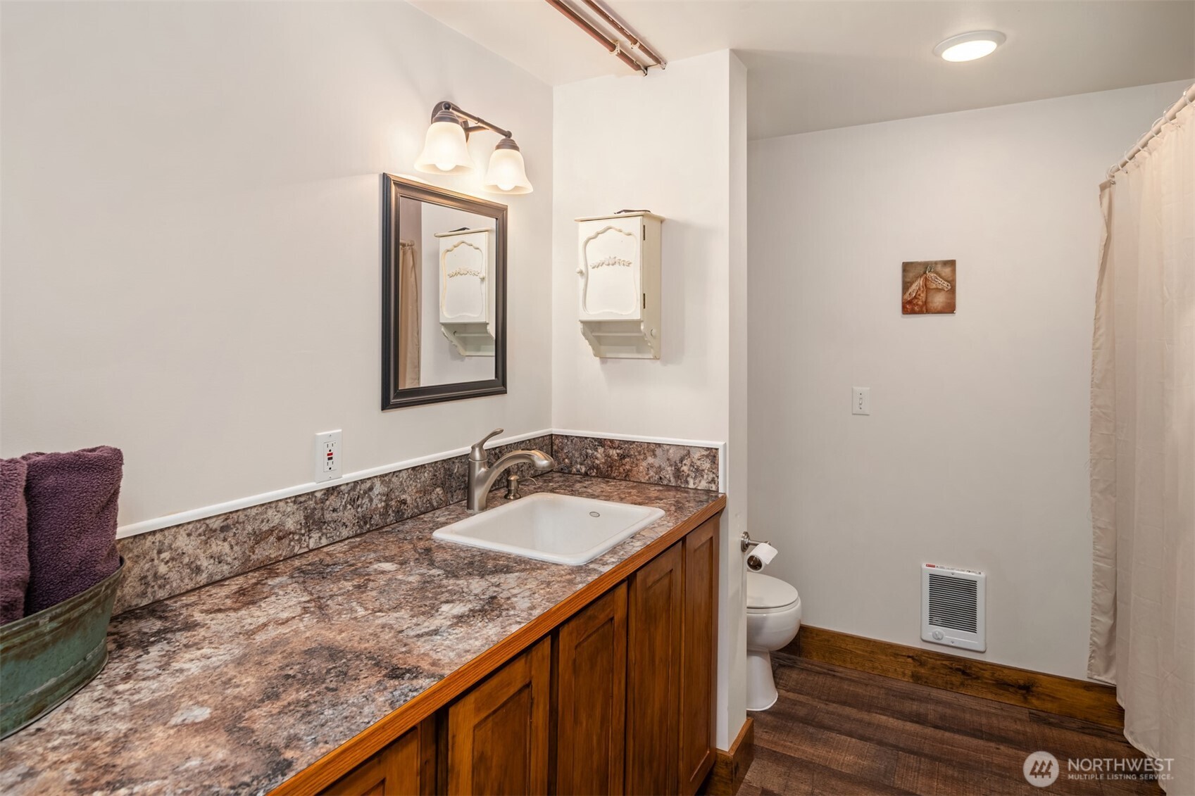 2762 Elgin Road Northeast Moses Lake, WA 98837 - Photo 33 of 37 a bathroom with a granite countertop sink mirror vanity and toilet