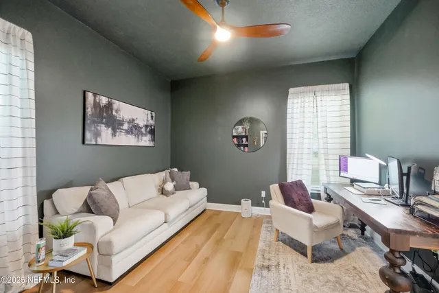 a bathroom with a shower a toilet and a sink