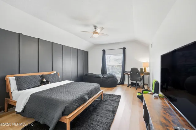 a view of an entryway with wooden floor