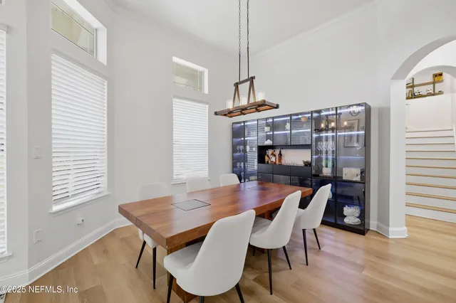 a view of a dining room with furniture window and wooden floor