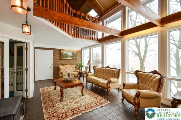 a living room with furniture and a large window