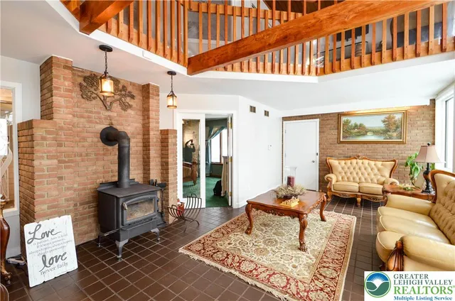 a living room with furniture and a rug