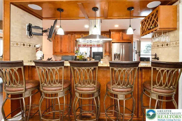 a dining area with chairs and table