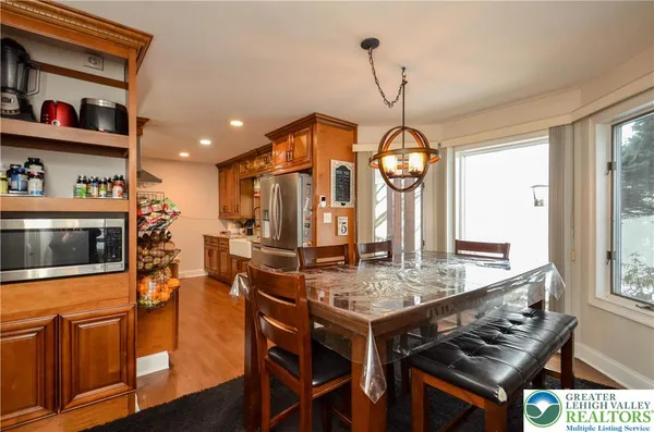 a view of a dining room with furniture window and wooden floor