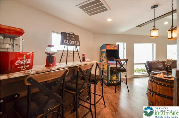 a view of a dining room with furniture and wooden floor