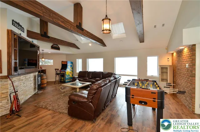 a living room with fireplace furniture and a flat screen tv