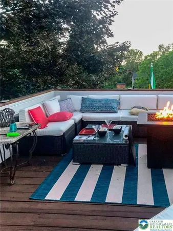 a view of outdoor sitting area with furniture