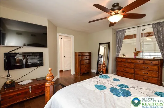 a bathroom with a sink a mirror and shower