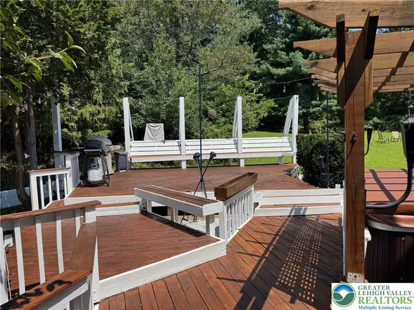 a swimming pool with outdoor seating and yard