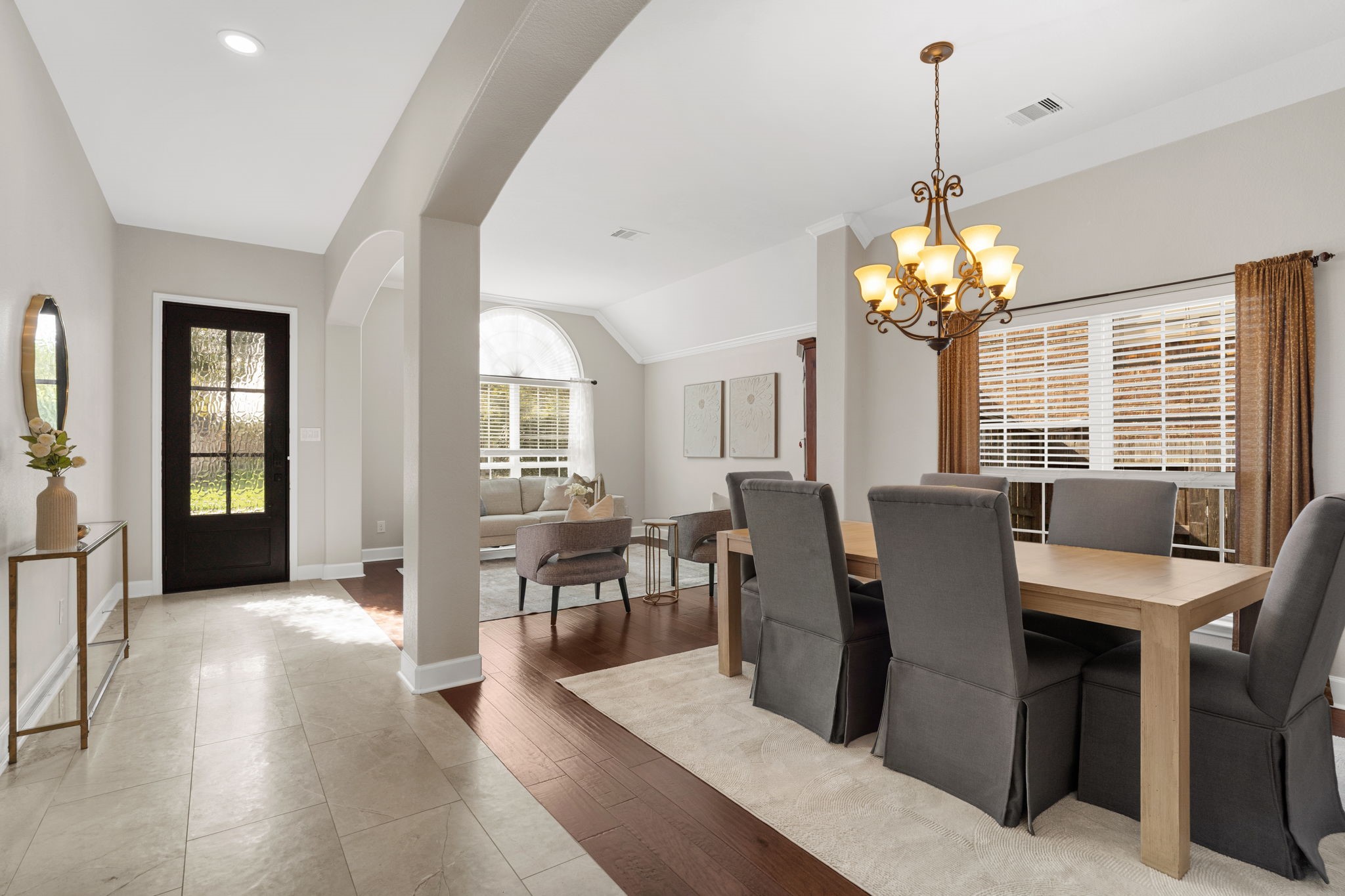 3426 Summer Ranch Drive Katy, TX 77494 - Photo 7 of 48 This extended dining and living space features graceful architectural details and seamless flow, creating an elegant setting that feels both open and connected.