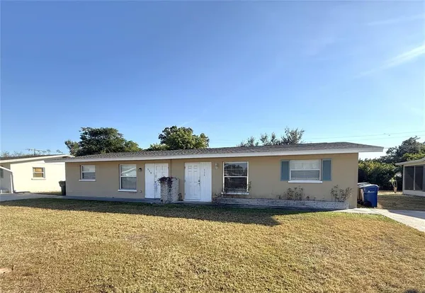 a outdoor view of house with yard