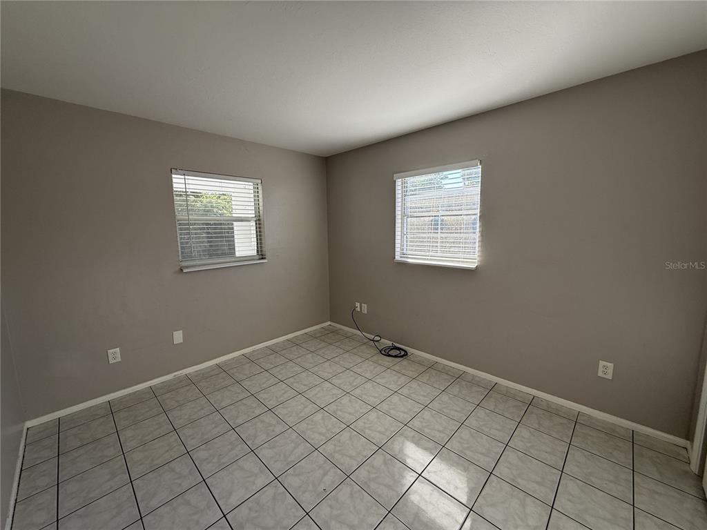 516 Briarwood Road Venice, FL 34293 - Photo 11 of 13 an empty room with windows