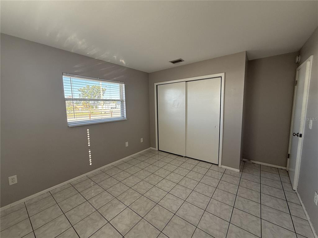 516 Briarwood Road Venice, FL 34293 - Photo 9 of 13 a view of an empty room and window