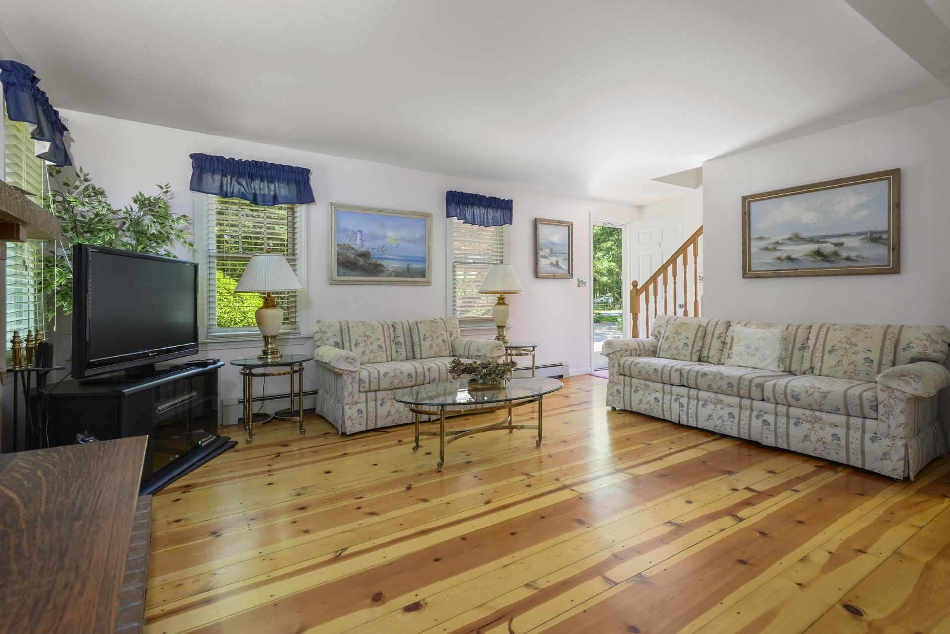 129 Oakwood Road Eastham, MA 02642 - Photo 12 of 30 a living room with furniture and a flat screen tv