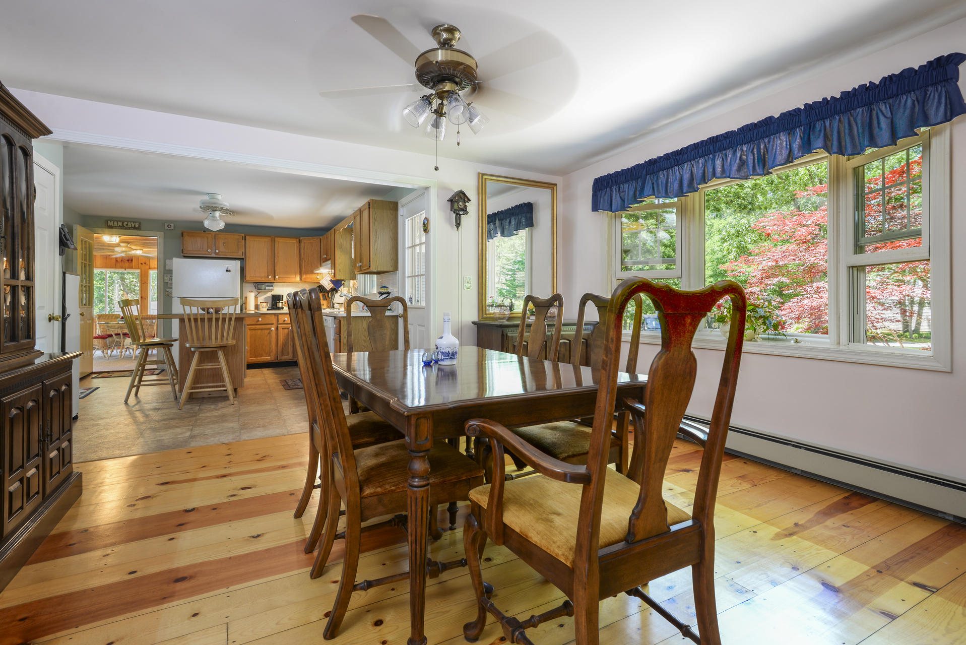 129 Oakwood Road Eastham, MA 02642 - Photo 14 of 30 a dining room with furniture a chandelier and wooden floor
