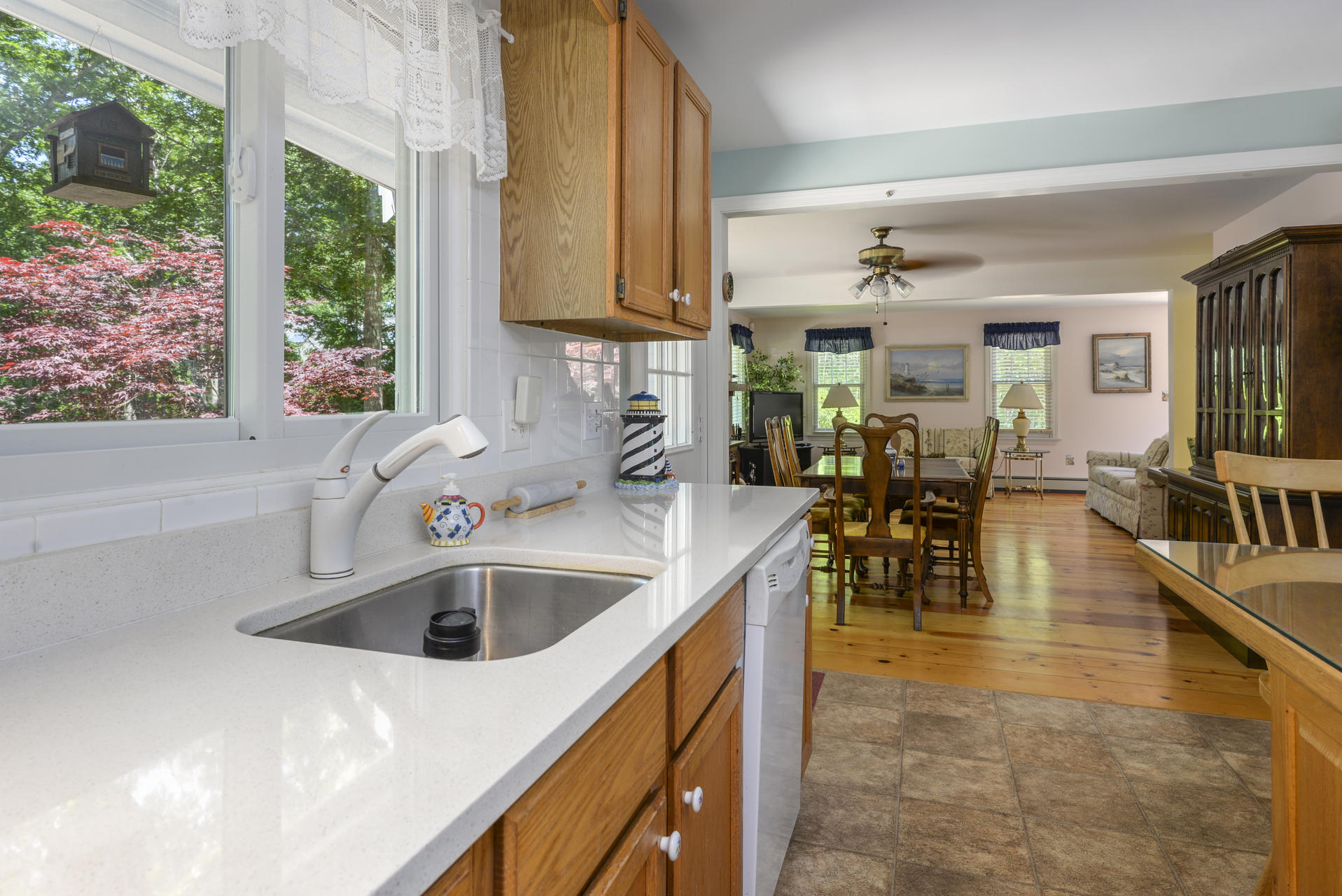 129 Oakwood Road Eastham, MA 02642 - Photo 15 of 30 a kitchen with stainless steel appliances a sink a counter top space and living room view