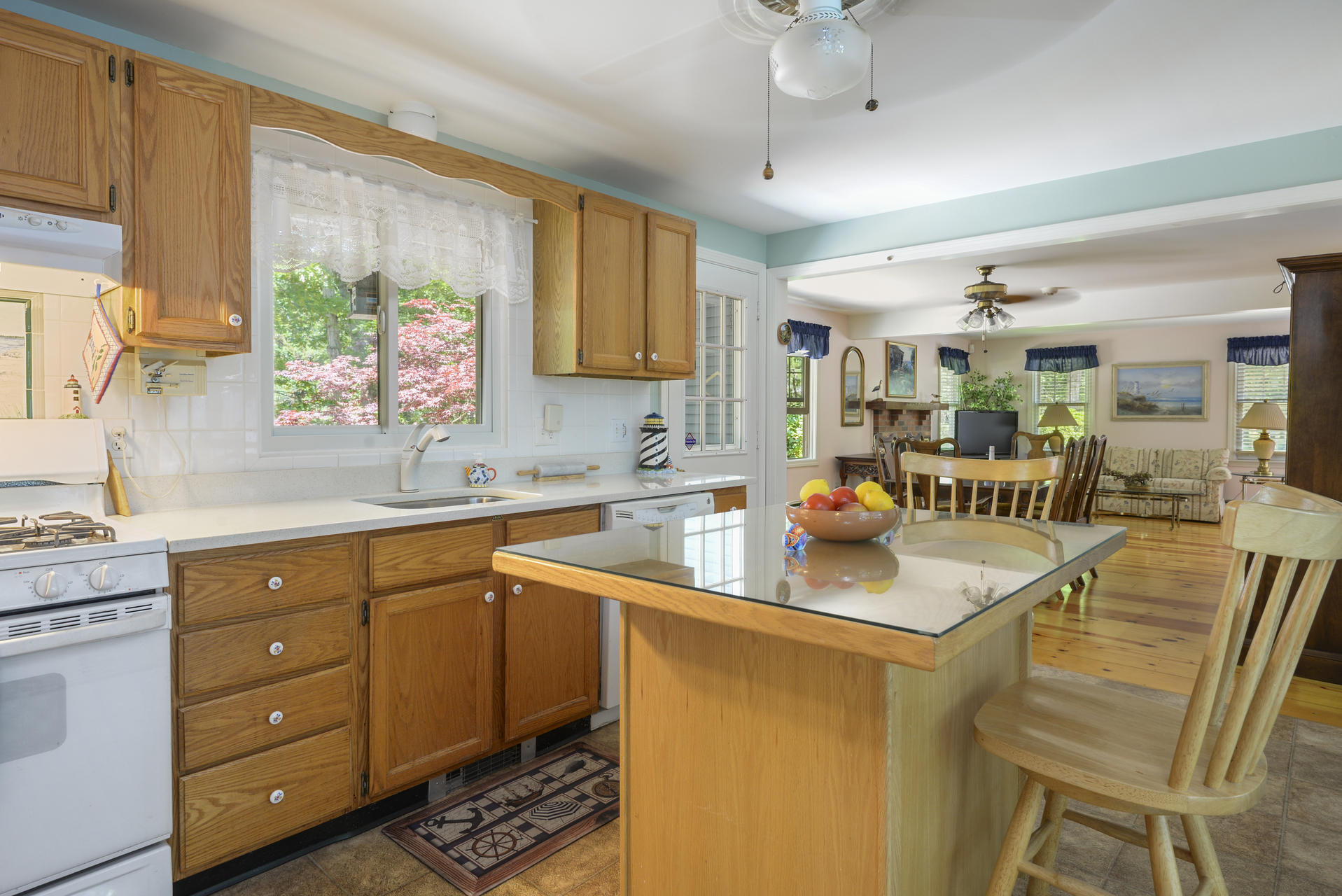 129 Oakwood Road Eastham, MA 02642 - Photo 17 of 30 a kitchen with a sink stove and cabinets