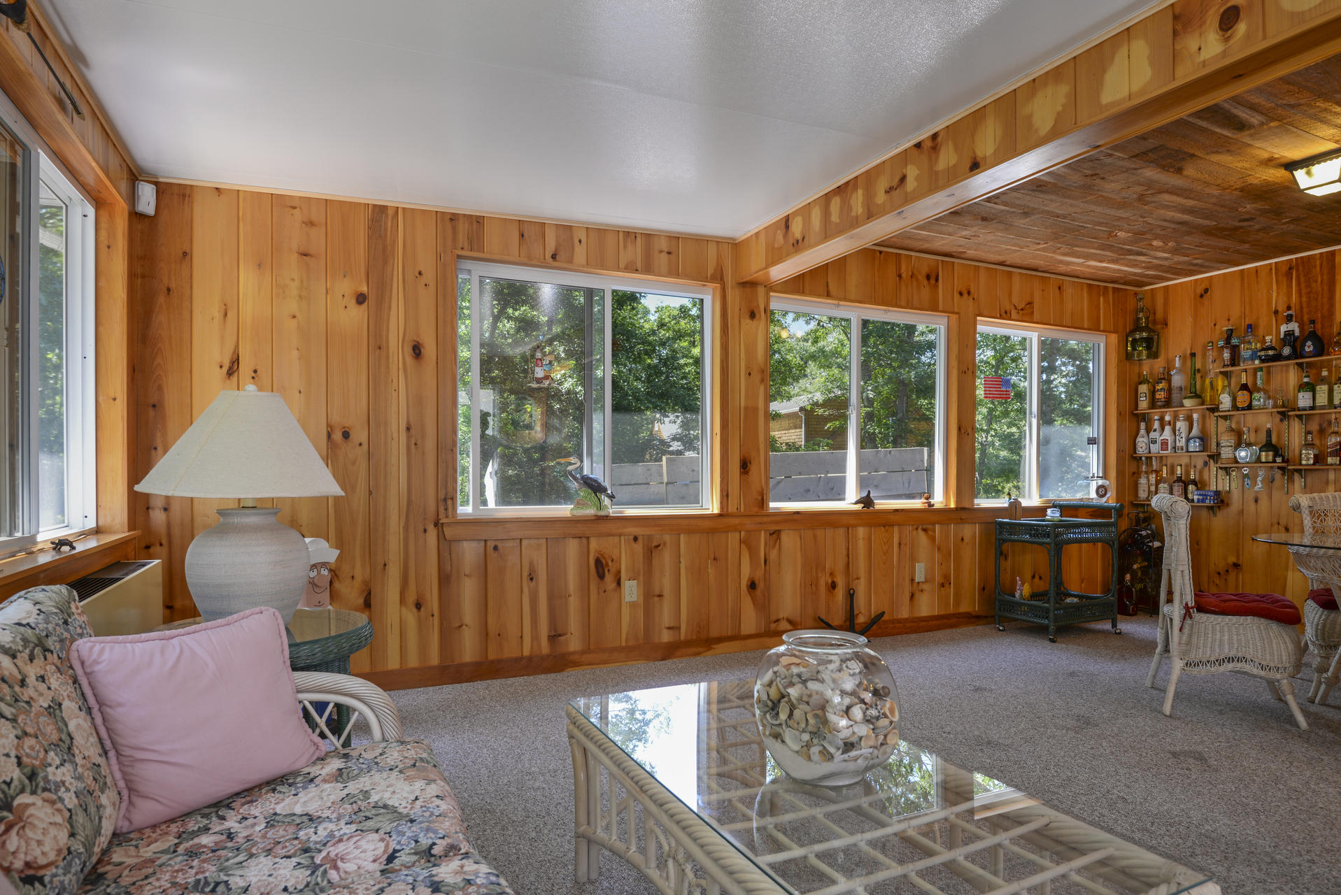 129 Oakwood Road Eastham, MA 02642 - Photo 21 of 30 a living room with furniture and a large window