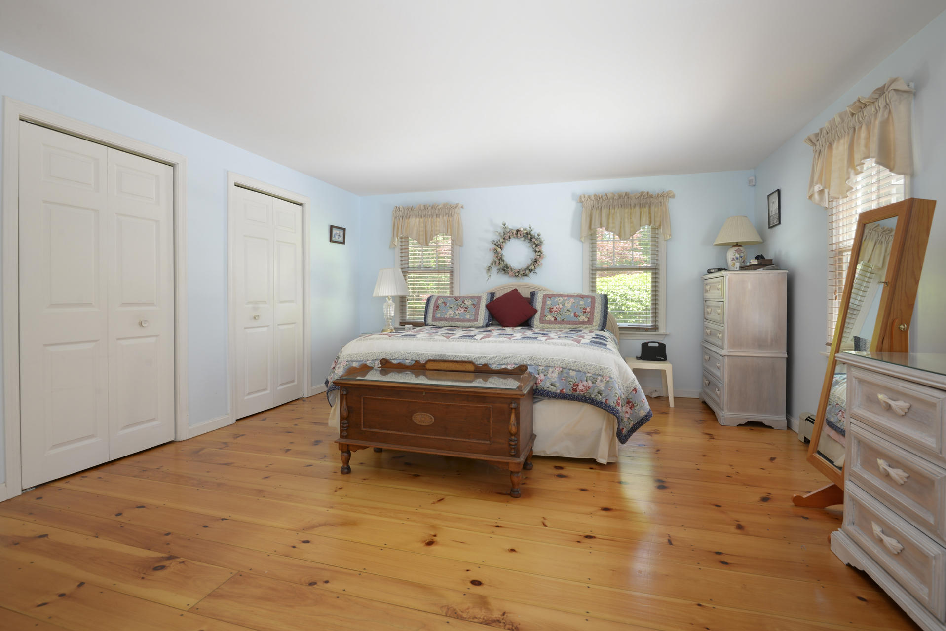 129 Oakwood Road Eastham, MA 02642 - Photo 24 of 30 a bedroom with a bed closet and a window