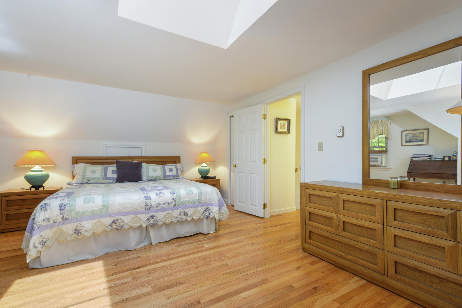 129 Oakwood Road Eastham, MA 02642 - Photo 27 of 30 a bedroom with a bed and a dresser