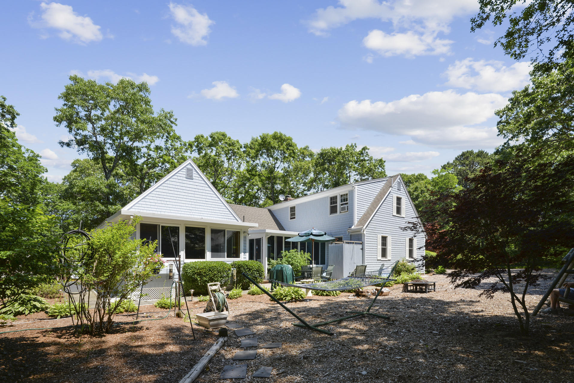 129 Oakwood Road Eastham, MA 02642 - Photo 5 of 30 a front view of a house with a yard