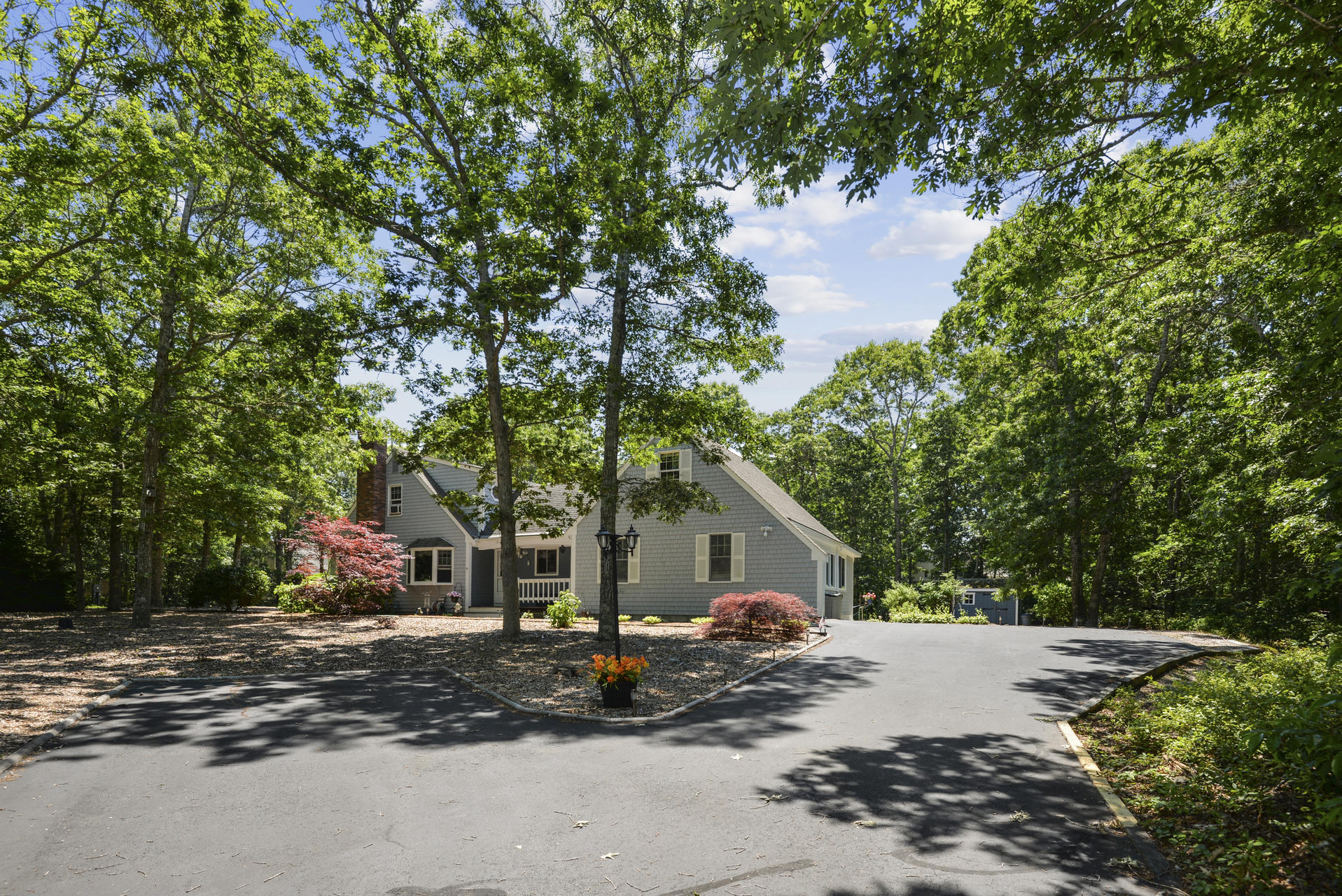 129 Oakwood Road Eastham, MA 02642 - Photo 9 of 30 a front view of a house with garden