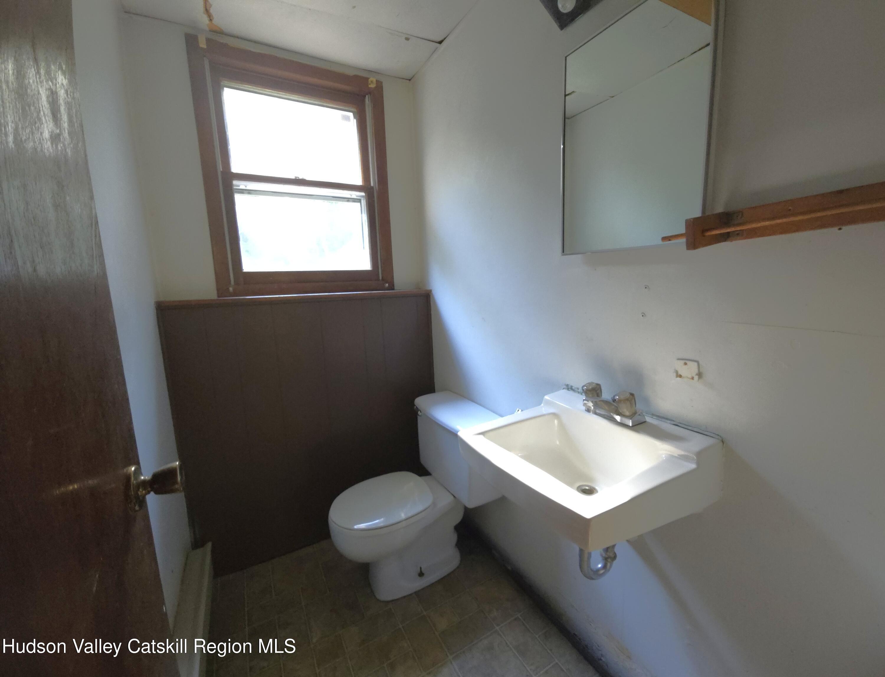 46 Cone Place Leeds, NY 12451 - Photo 14 of 20 a bathroom with a sink toilet and mirror