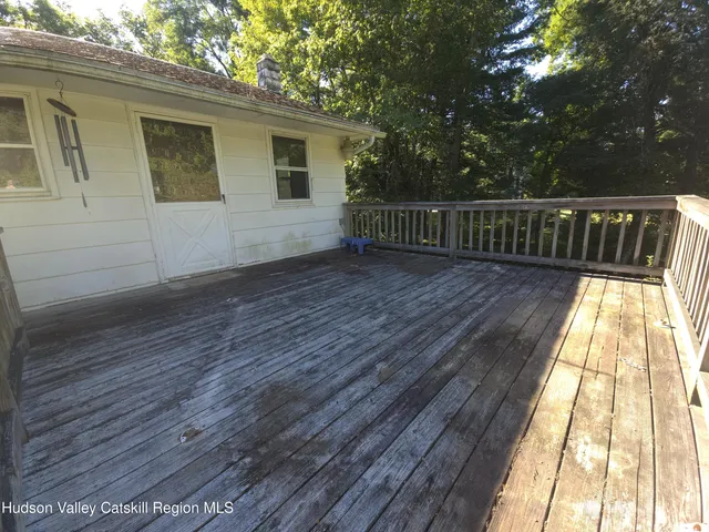 a view of deck with wooden floor and fence