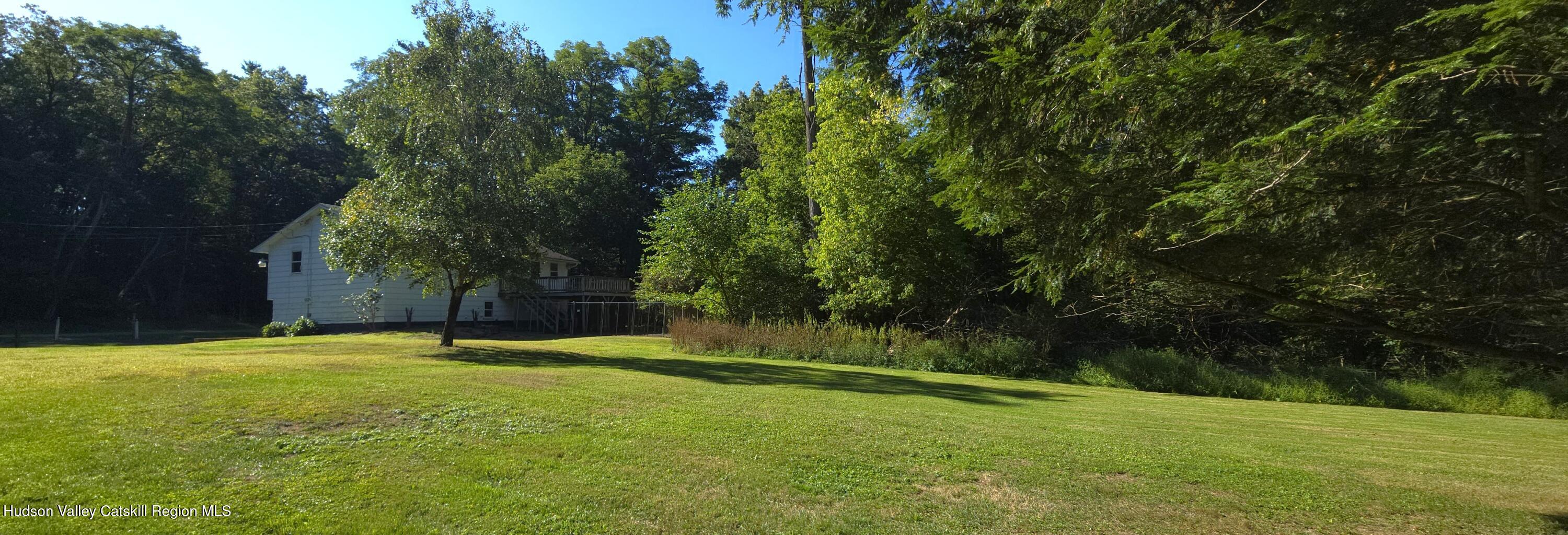 46 Cone Place Leeds, NY 12451 - Photo 19 of 20 a view of a field with trees in the background