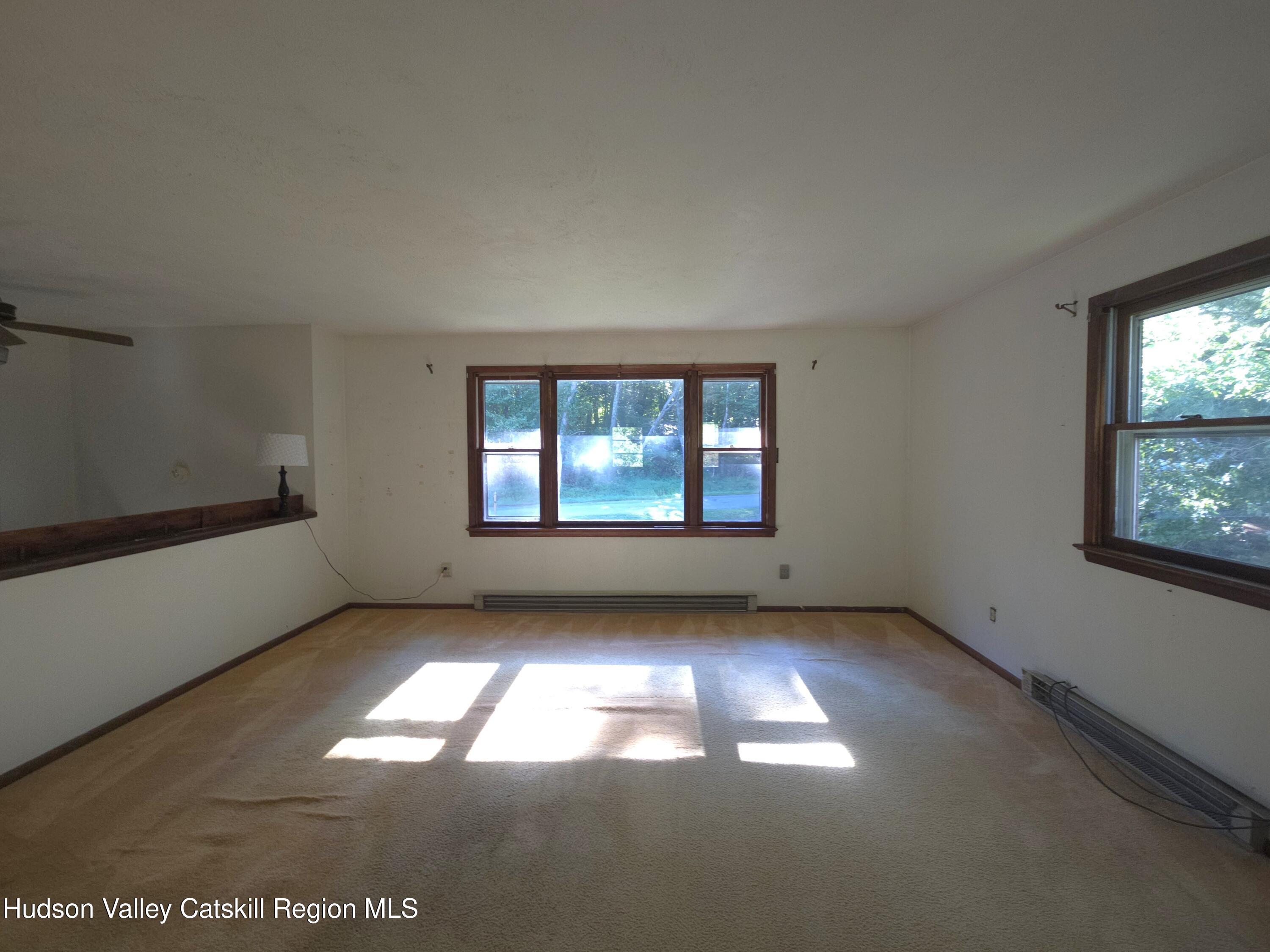 46 Cone Place Leeds, NY 12451 - Photo 4 of 20 an empty room with windows