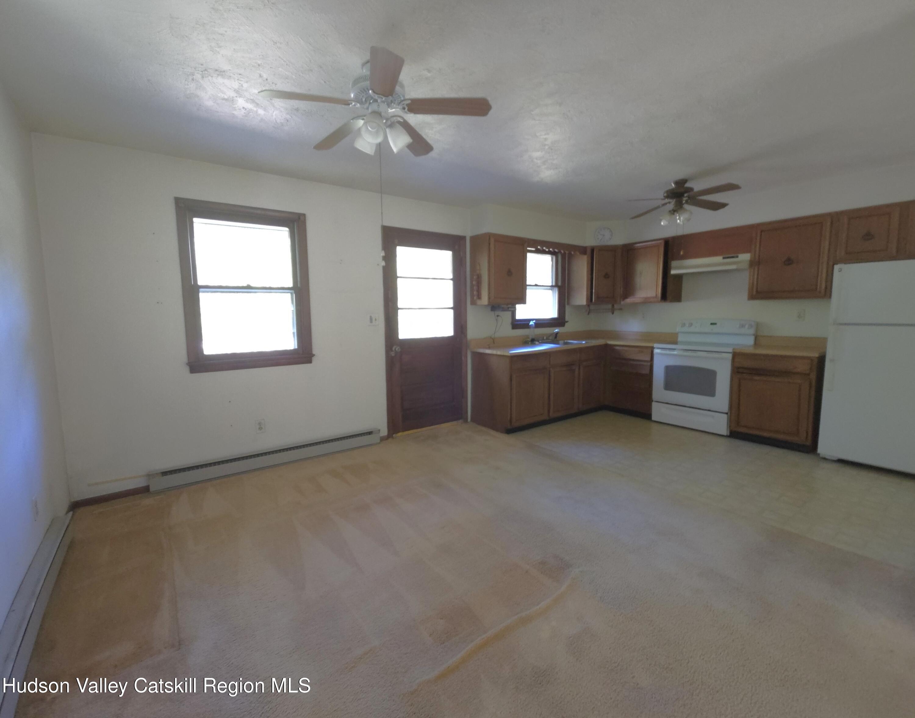 46 Cone Place Leeds, NY 12451 - Photo 7 of 20 a large kitchen with window and stainless steel appliances