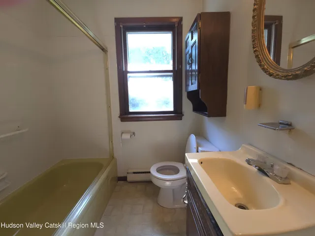 a bathroom with a sink a toilet and a bathtub