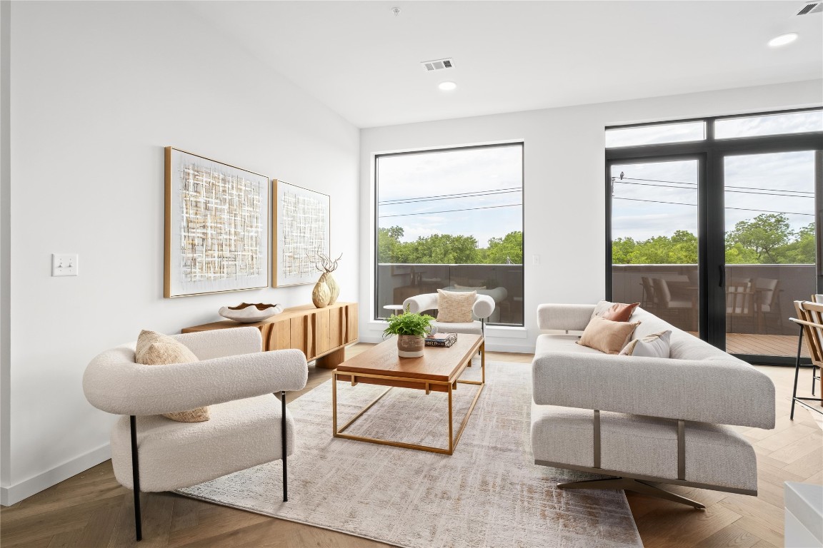2209 South 1st Street, Unit 403 Austin, TX 78704 - Photo 2 of 40 a living room with furniture and a large window
