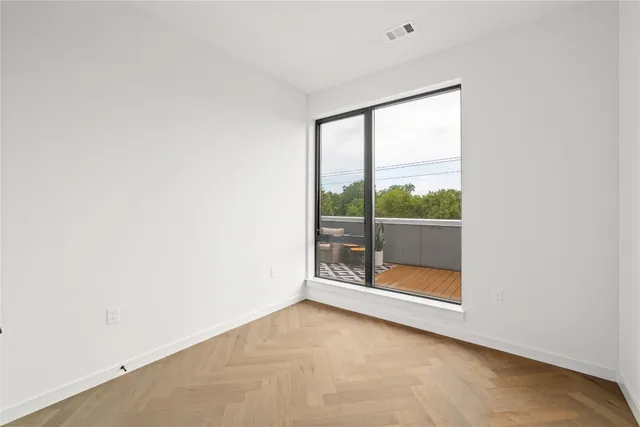 an empty room with glass door