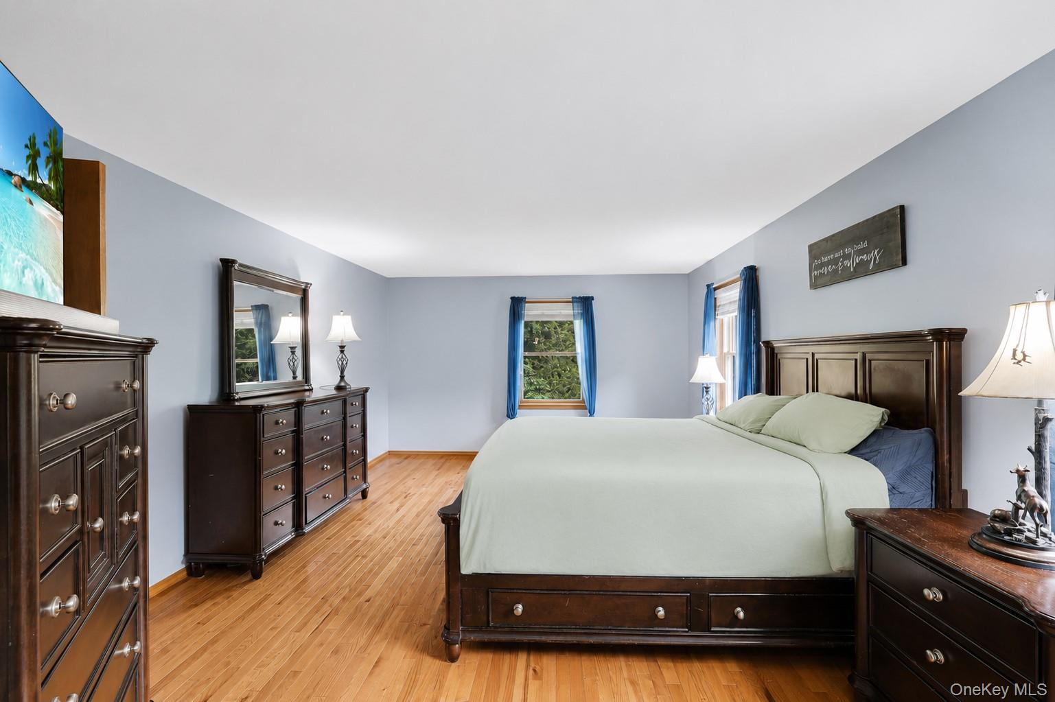 185 Rombout Road Pleasant Valley, NY 12569 - Photo 38 of 49 a bedroom with a bed and wooden floor