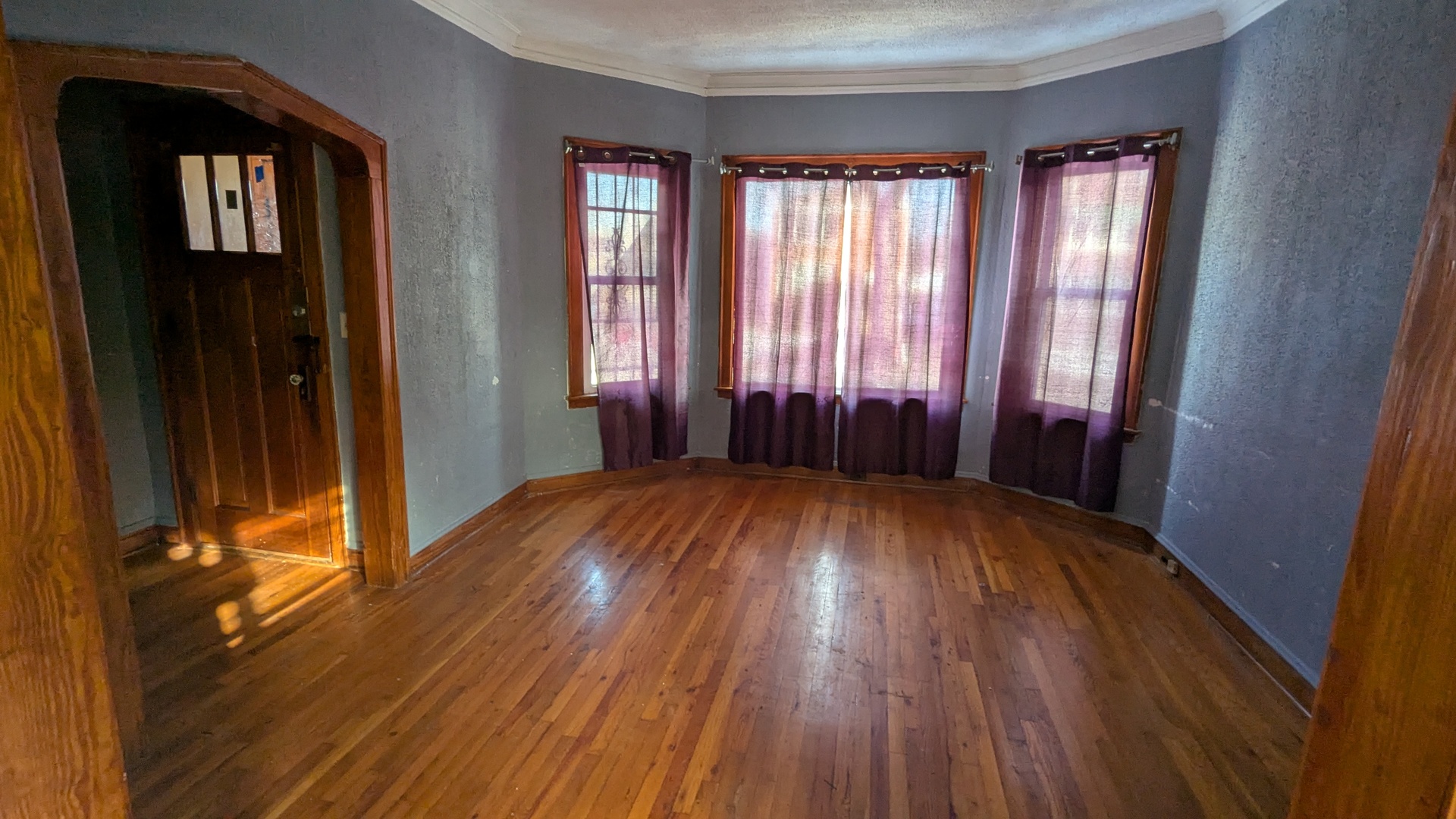 8112 South Exchange Avenue Chicago, IL 60617 - Photo 16 of 35 wooden floor in an empty room with a window