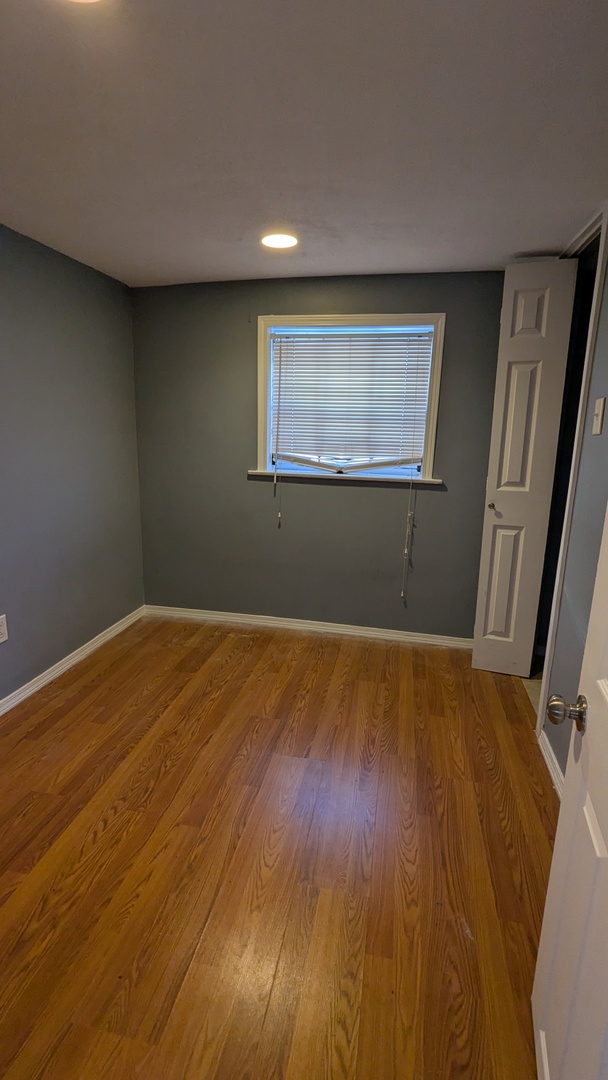 8112 South Exchange Avenue Chicago, IL 60617 - Photo 23 of 35 a view of empty room with wooden floor