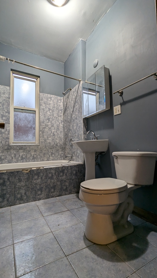 8112 South Exchange Avenue Chicago, IL 60617 - Photo 7 of 35 a bathroom with a toilet and a sink